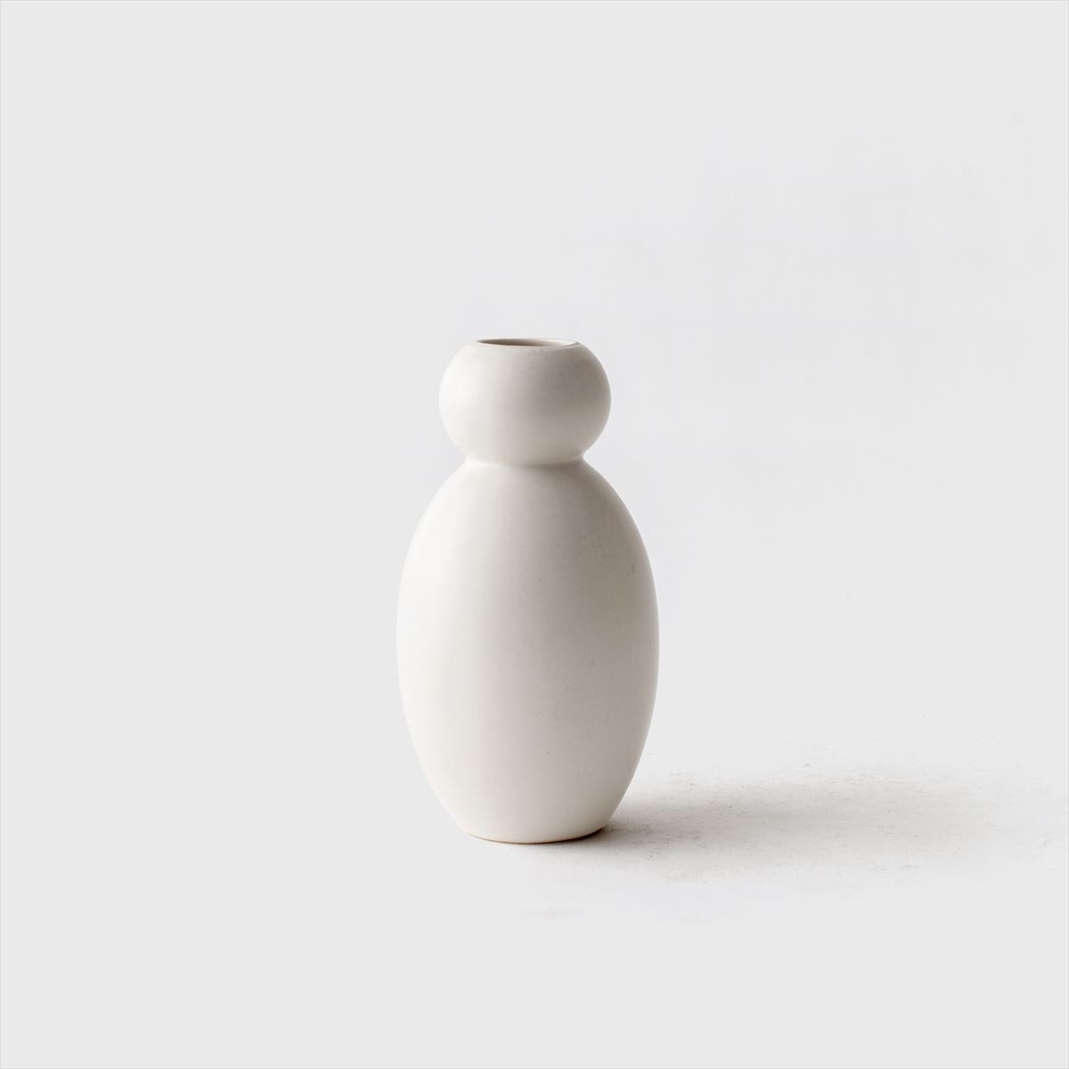 white flower vase