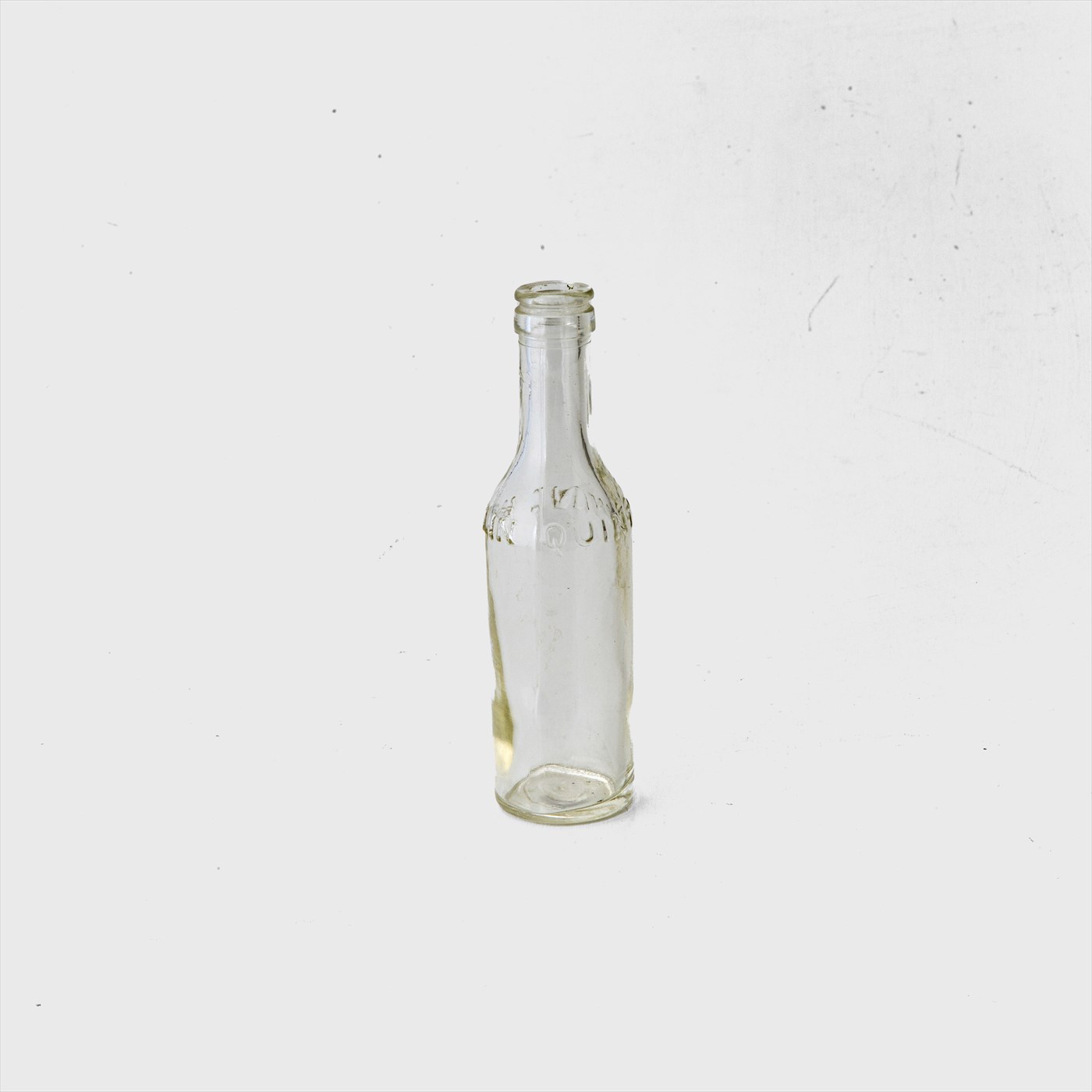 clear glass letter bottle