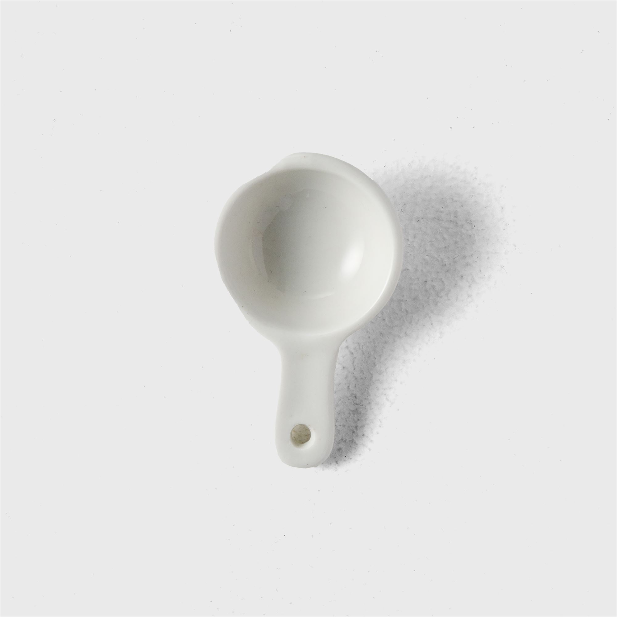 white seasoning spoon