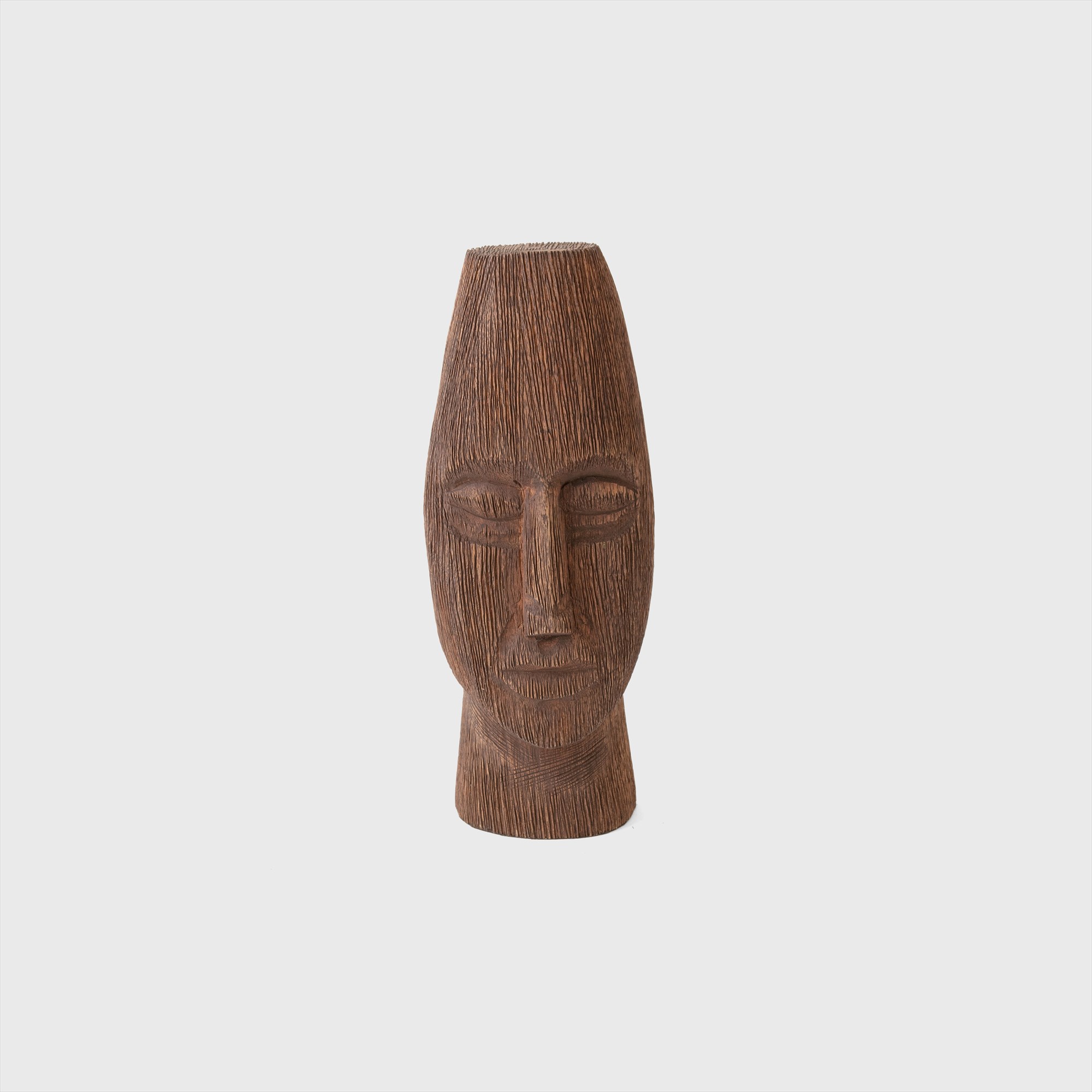 wood carving of face