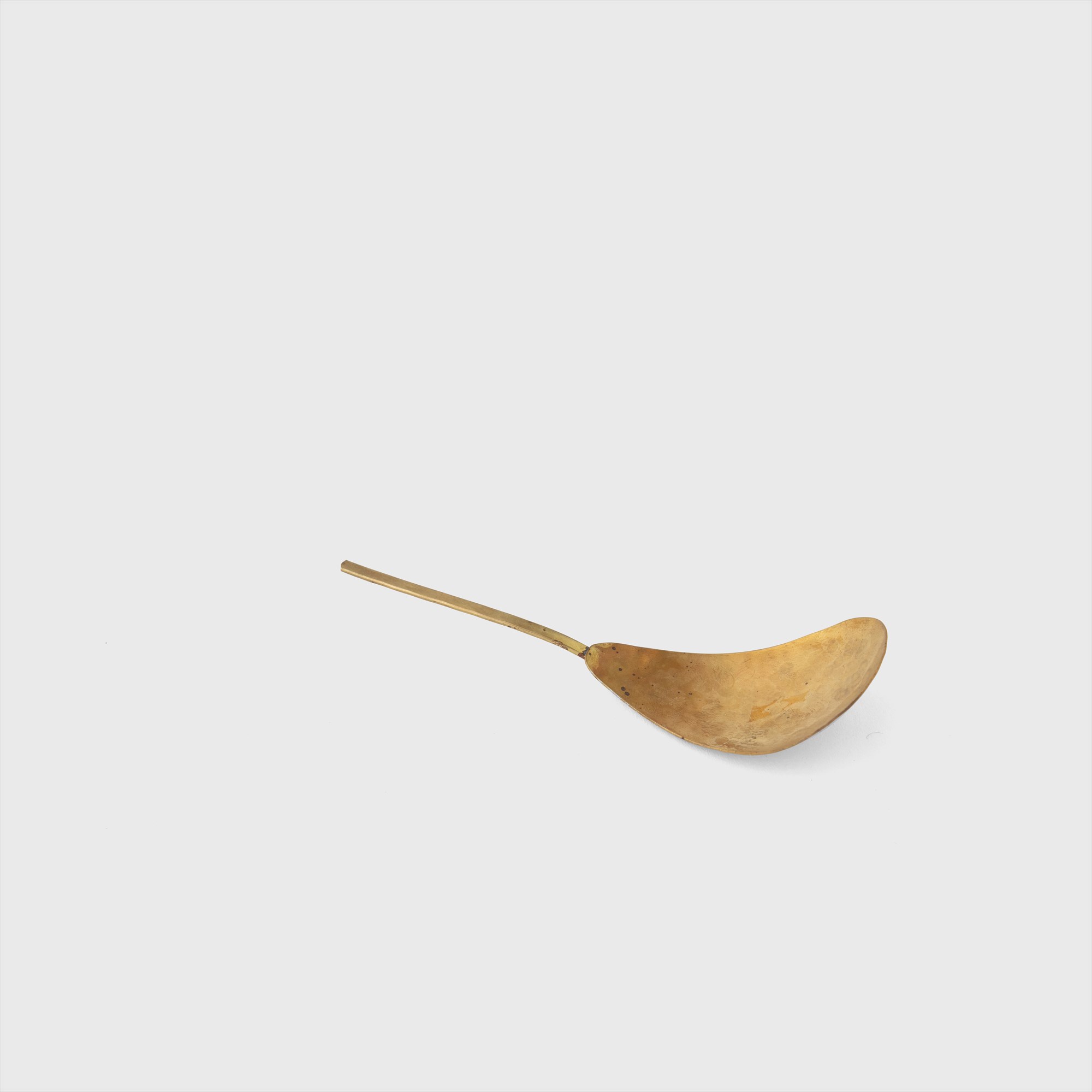 brass server spoon